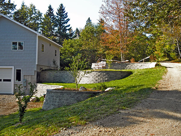 Stone retaining wall with multiple levels.