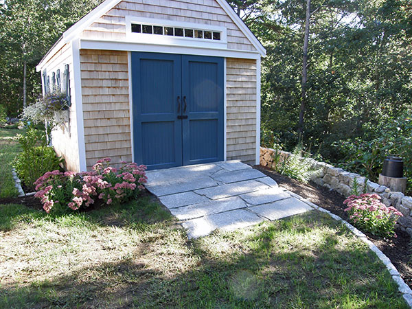 Shed with stone ramp.