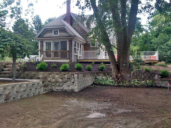 A home showing the engineering and construction of retaining walls,
driveway, stone steps, and natural plantings.